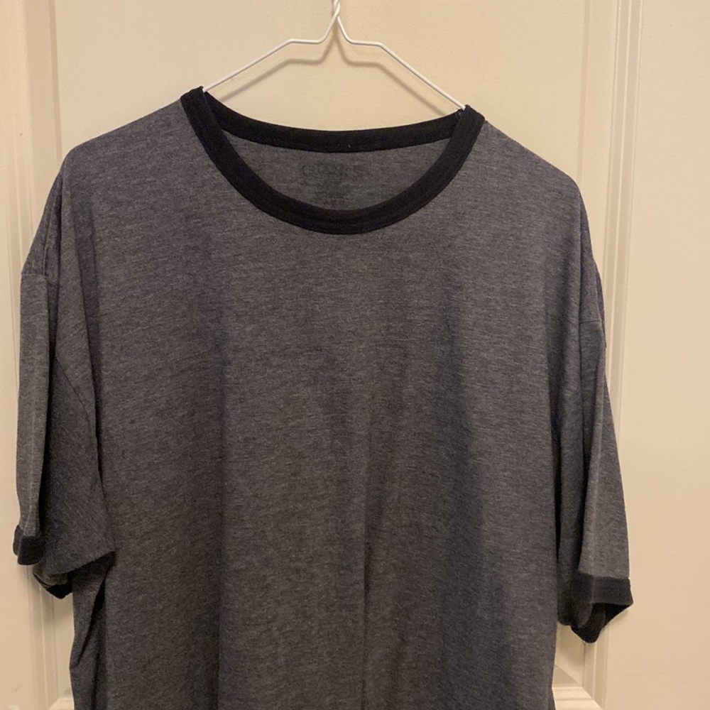 Short sleeve grey t-shirt, with black trim around neck and sleeve